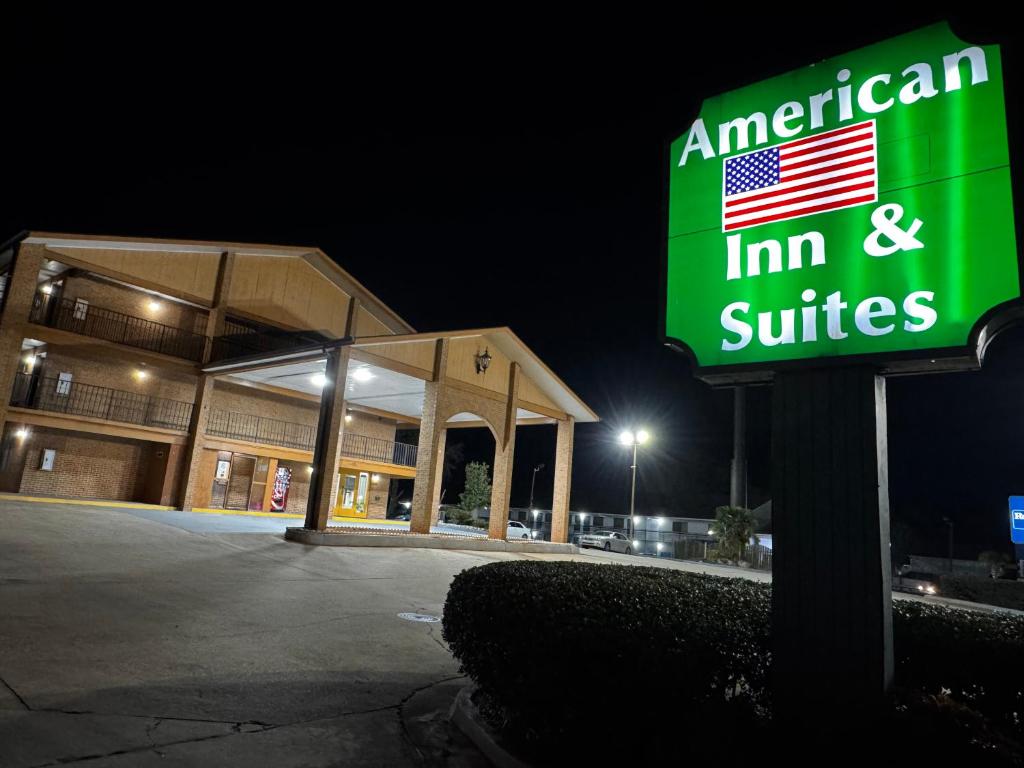 American Inn & Suites sign lit at night, Jonesboro GA