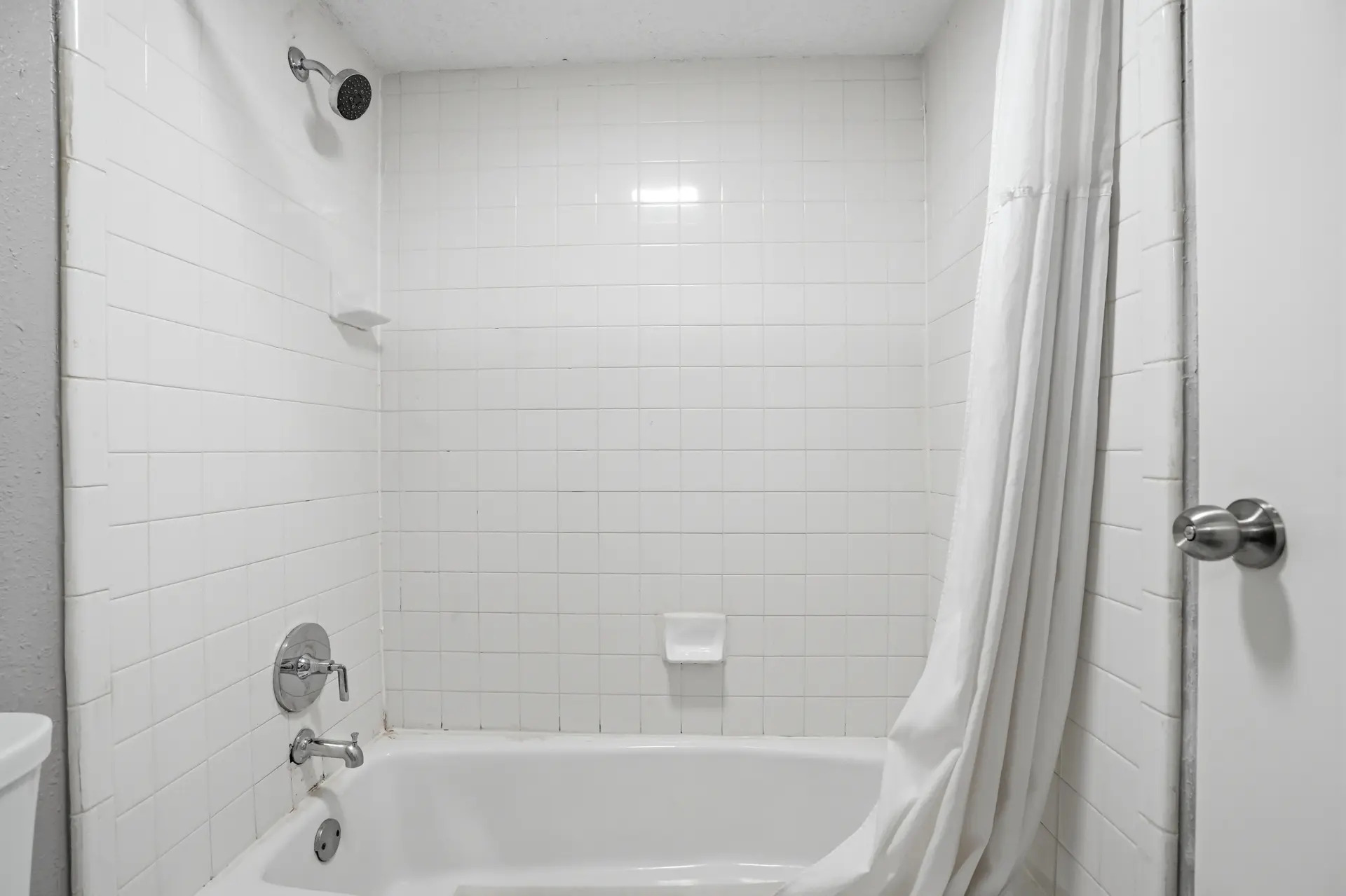 Bathtub in the One-Bedroom King Suite at American Inn & Suites, Jonesboro GA